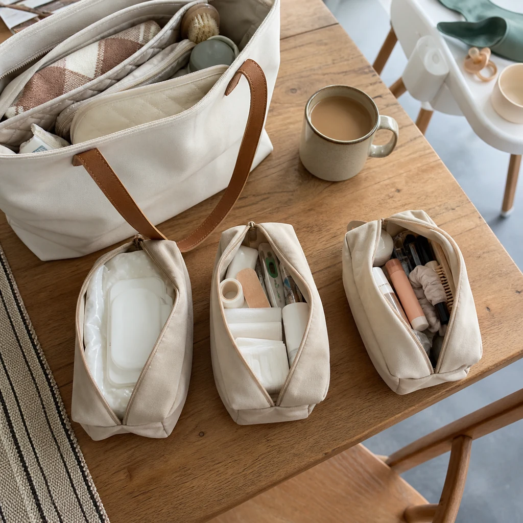 Small neutral pouches organize practical mom bag essentials